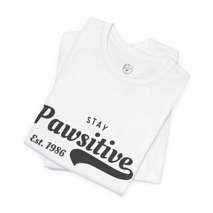 Stay Pawsitive Unisex Jersey Tee, Positive Vibes Shirt, Gift for Animal Lovers, Casual Everyday Wear, Fun Humor T-Shirt, Pet-themed Tee