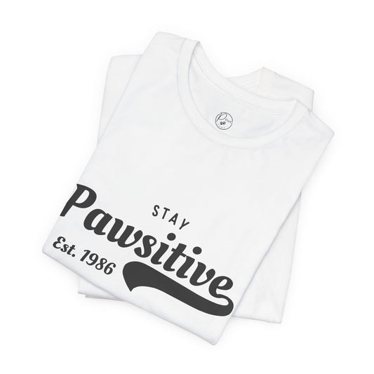 Stay Pawsitive Unisex Jersey Tee, Positive Vibes Shirt, Gift for Animal Lovers, Casual Everyday Wear, Fun Humor T-Shirt, Pet-themed Tee