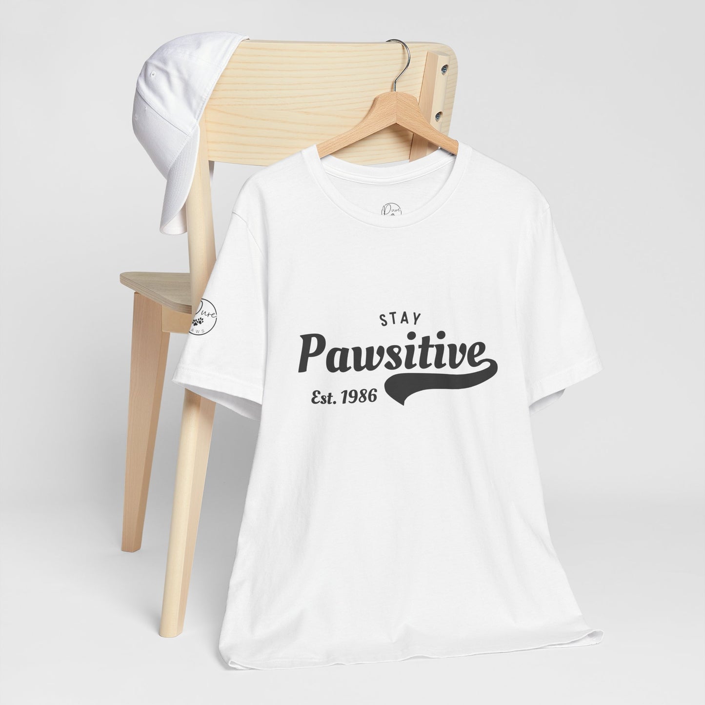 Stay Pawsitive Unisex Jersey Tee, Positive Vibes Shirt, Gift for Animal Lovers, Casual Everyday Wear, Fun Humor T-Shirt, Pet-themed Tee